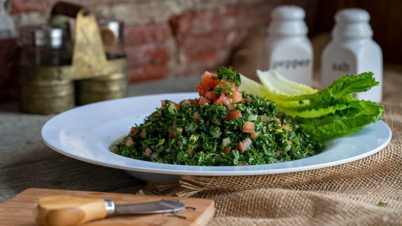 Tabbouleh Salad · A light and fresh mix of parsley, diced tomato, green onion and cracked wheat. Served with our unique Tabbouleh dressing