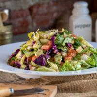 House Salad · A fresh mix of crisp romaine lettuce, tomato, cucumber, onion, shredded carrots and red cabb...