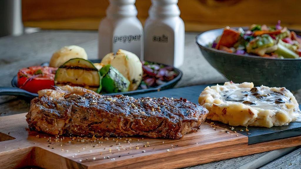12 Oz. New York Strip Steak Dinner · 12 oz. New York Strip Steak grilled to your preference, served with your choice of two sides: mashed potatoes, soup, salad or fries