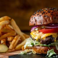 Brioche Burger · Deliciously juicy flame-grilled1/2 lb Black Angus beef patty topped with melted American che...