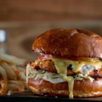 The Butcher'S Chicken Burger · Your choice of grilled chicken breast or fried chicken tenders layered with melted Swiss che...