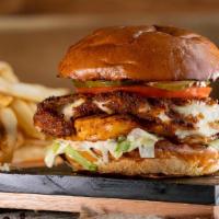 Mozzarella Chicken Burger · Marinated grilled chicken breast topped with a breaded mozzarella patty, crisp lettuce, toma...