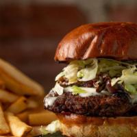 Mushroom Swiss Burger · Perfectly flame-grilled 1/2 lb Black Angus beef patty topped with melted Swiss cheese, cream...