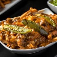 Chicago Poutine · fries with gravy and cheese curds. smoked brisket and jalapenos