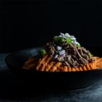 Good For You Nachos · Sweet potato “fries” topped with shredded beef, guacamole, salsa, green peppers and red onio...