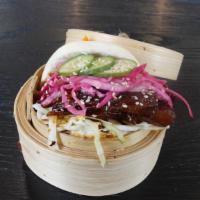 Teriyaki Pork Belly Bao · Pork belly infused in our signature Teriyaki Sauce, pickled cabbage, cucumbers, and sesame. ...