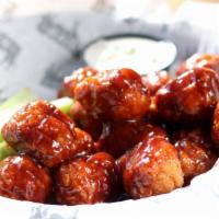 Chicken Wings · Crisp on the outside, juicy on the inside – perfect bone-in wings with choice of garlic Buff...