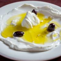 Labneh · Cream yogurt, top with virgin olive oil and kalamata olive.
