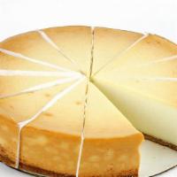 Slice New York Style Cheesecake · A rich creamy dessert in the traditional New York style with chocolate, caramel or strawberr...