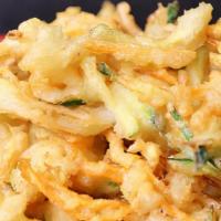 Veggie Tempura · Julienned carrots, onions, and zucchini fried in a crispy tempura batter served with housema...