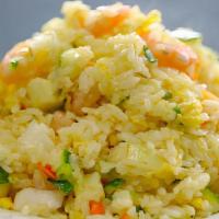 Fried Rice · Fried rice with your choice of meat. Diced carrots, onions, scallions stir fried with egg in...