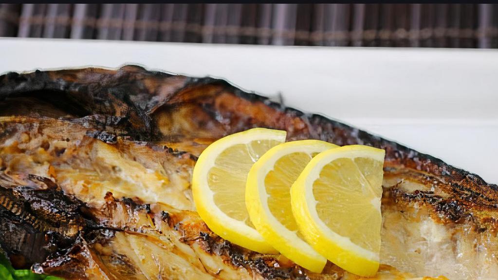 Chub Mackerel · Whole bone-in silver belly chub mackerel salted and seared. Served with sliced lemon and truffle salt.