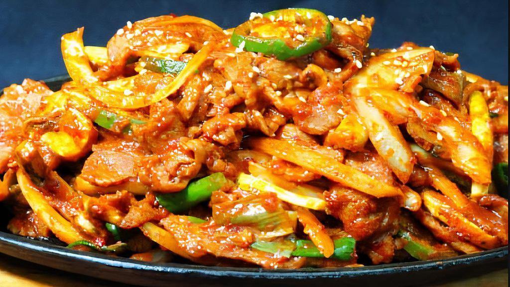 Jeyuk Bokkeum (Pork Stir Fry) · Tender marinated pork, onions, scallions, mushrooms and jalapenos stir fried in a spicy red garlic sauce.