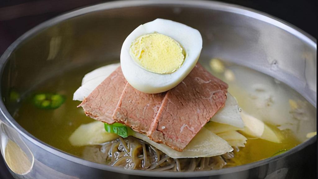 Mul Naeng Myun · Beef brisket, pickled radish, cucumbers slices, jalapenos and hard-boiled egg layered on top of thin buckwheat noodles in icy beef broth. Served with vinegar and hot mustard.