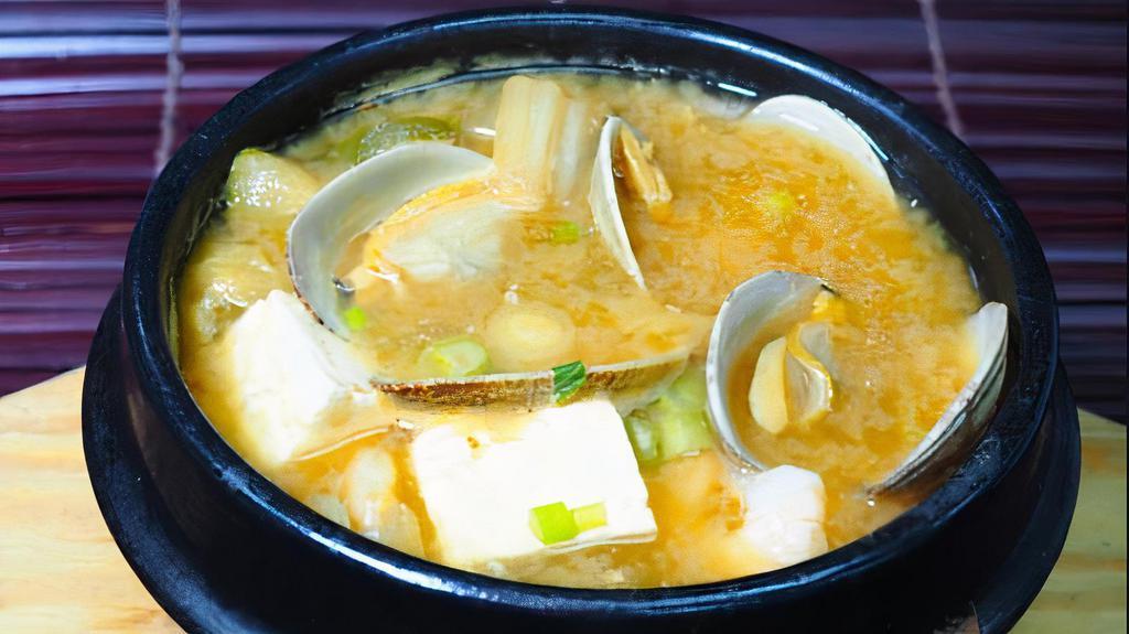 Haemul Doenjang Chigae · Shrimp, clam, tofu, scallions, zucchini, mushrooms, onions and jalapenos served boiling in a fermented soybean broth.