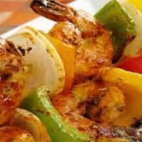 Alambre Camarones Mixtos/Shrimp Mix · Topped with Bell Peppers, Onions, Cheese, and Salsa/ Con Chiles Pimientos, Cebolla, Queso, Y...