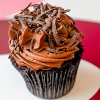 Chocolate Chocolate Cupcake · Chocolate cupcake frosted with chocolate buttercream topped with pure dark chocolate paillet...