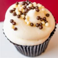 Chocolate Vanilla Cupcake · Chocolate cupcake frosted with vanilla bean buttercream topped with pure chocolate paillettes.