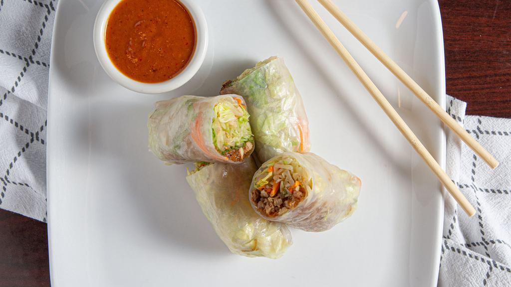 Summer Rolls (2) · Ground chicken and fresh vegetables mixed in a steamed rice paper wrap. Served with Thai peanut sauce.