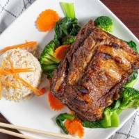 Asian Bbq Ribs · Baby back ribs grilled with our house bbq sauce and served with steamed vegetables