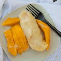Mango Sticky Rice (White Rice) · Sticky rice with slices of mango, covered in a coconut glazed topped with sesame seeds choic...