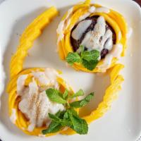 Mango Sticky Rice (Black Rice) · Sticky rice with slices of mango, covered in a coconut glazed topped with sesame seeds choic...