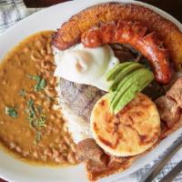 Bandeha Paisa Montanera · Top menu item. Grill top round steak served with rice, beans, one fried eggs, colombian saus...