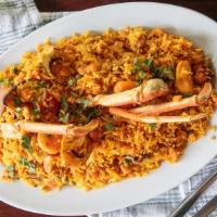 Arroz Marinero · Fried yellow rice mixed with shrimp, mussels, clams, tilapia fish, crab legs, crab meat, cal...