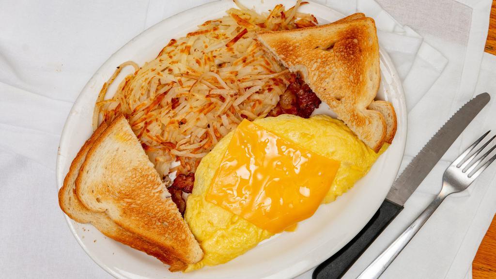 Cheese Omelet With Meat · Cheese Omelet with your Choice of meat (Bacon, Sausage or Ham) Served with your Choice of Potatoes and Toast.