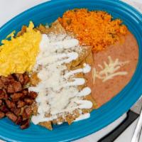 Chilaquiles  · Fried Tortillas tossed in your Choice of Salsa (Red or Green), Topped with Onion, Queso Fres...