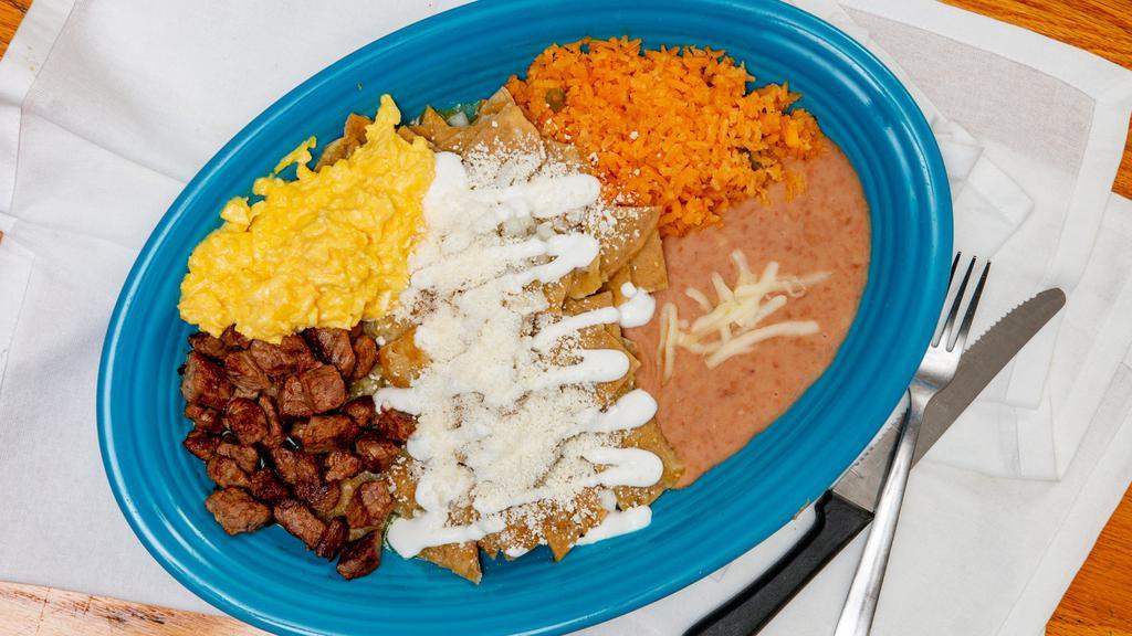 Chilaquiles  · Fried Tortillas tossed in your Choice of Salsa (Red or Green), Topped with Onion, Queso Fresco (Mexican Cheese) and Sour Cream and (3) Eggs, and your Choice of Meat. Served with Rice and Beans.
