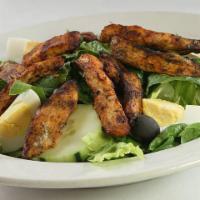 Grilled Chicken Caesar Salad · Most popular. Grilled chicken breast over lettuce, tomatoes, black olives and Caesar dressing.