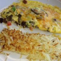 Max Omelet · Ham, bacon, sausage, sautéed onions, mushrooms, green peppers and tomatoes topped with chedd...
