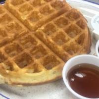 Deluxe Belgian Waffle · Mom's favorites. Served with two eggs any style, hash browns and choice of bacon strips, sau...