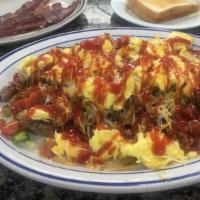 Meat Lover'S Skillet · Mom's favorites. Two eggs any style with hash browns, topped with cheddar jack cheese, diced...