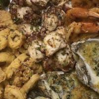 Rockefeller Seafood Platter · Grilled spiced shrimp, grilled octopus, crispy calamari, Rockefeller oysters, and baked cher...