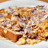 Crunchy French Toast · Thick cut challah bread dipped in our special batter coated in corn flakes and served with c...