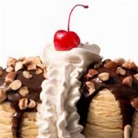 Brownie Delight · Chocolate brownies, ice cream and hot fudge, topped with peanuts, whipped cream and a cherry...