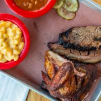 2 Meat Plate · Choose any two of our hickory smoked meats and your choice of two sides.