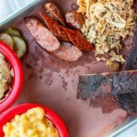 Notorious P.I.G. · St. Louis ribs, pulled pork, Usinger's sausage and your choice of two sides.