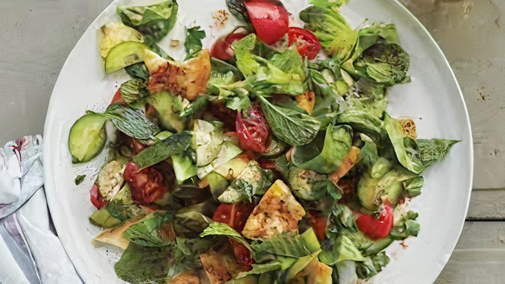 Fattoush Salad · Lettuce, Tomatoes. Cucumbers, Onions, Olive Oil, Lemon Juice, Apple Vinegar n' pita chips