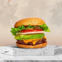 Cadet Cado Burger · American beef patty topped with avocado, melted cheese, lettuce, tomato, onion, and pickles....