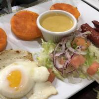 Llapingachos · Three potato cheese cakes. Served with one egg, hot dog, salad, and peanut butter sauce.