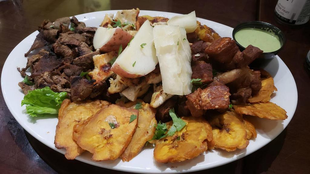 Bandeja Paisa (Montanera) · Grilled top round steak served with rice, beans, one fried egg, colombian sausage, corn cake, crackling, avocado, sweet plantain, and cilantro.