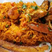 Arroz Marinero · Fried yellow rice mixed with shrimp, mussels, clams, tilapia fish, crab legs, crab meat, and...
