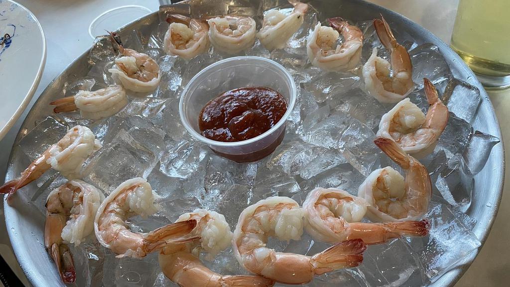 Cocktail Shrimp · Shelled prawns served with a cocktail sauce.