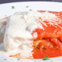 Lasagna Alla Bolognese · A napoli villa specialty. Our famous handmade layered lasagna topped with tomato and Alfredo...