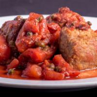 Medaglioni Alla Pizzaiola · Filet medallions sautéed in brandy with capers and fresh diced tomatoes.