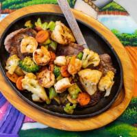 Steak Toluqueño  · Ribeye steak grilled with shrimp and a blend of
vegetables including broccoli, cauliflower, ...