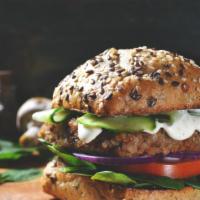 Tahini Cheeseburger · Our savory cheeseburger garnished with fresh lettuce, tasty onions, tomatoes, and tahini sau...